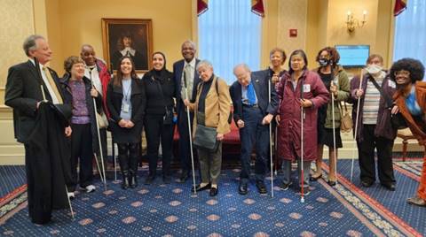 NFBMD members stand with sponsor Senator Benjamin Brooks at Senate Accessible Electronic Ballot Return Voting bill hearing
