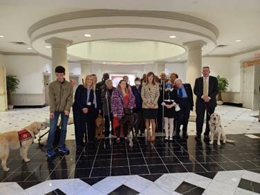 NFBMD members stand with sponsor Senator Mary Dulany James at Senate Guide Dog Protections in Housing bill hearing