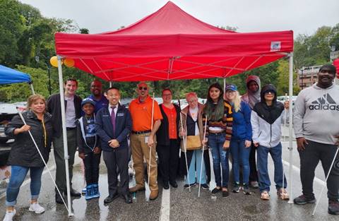 NFBMD members, Senator Lam, and Delegate Feldmark receive White Cane Day proclamation at Wizarding Weekend on Magical Main to commemorate Blind Equality Achievement Month