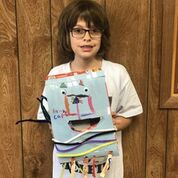 shows a girl with a box she has decorated.